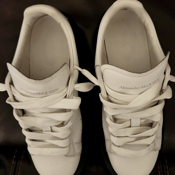 Like new oversized sneakers from Alexander McQueen. Between $500-700 new.
